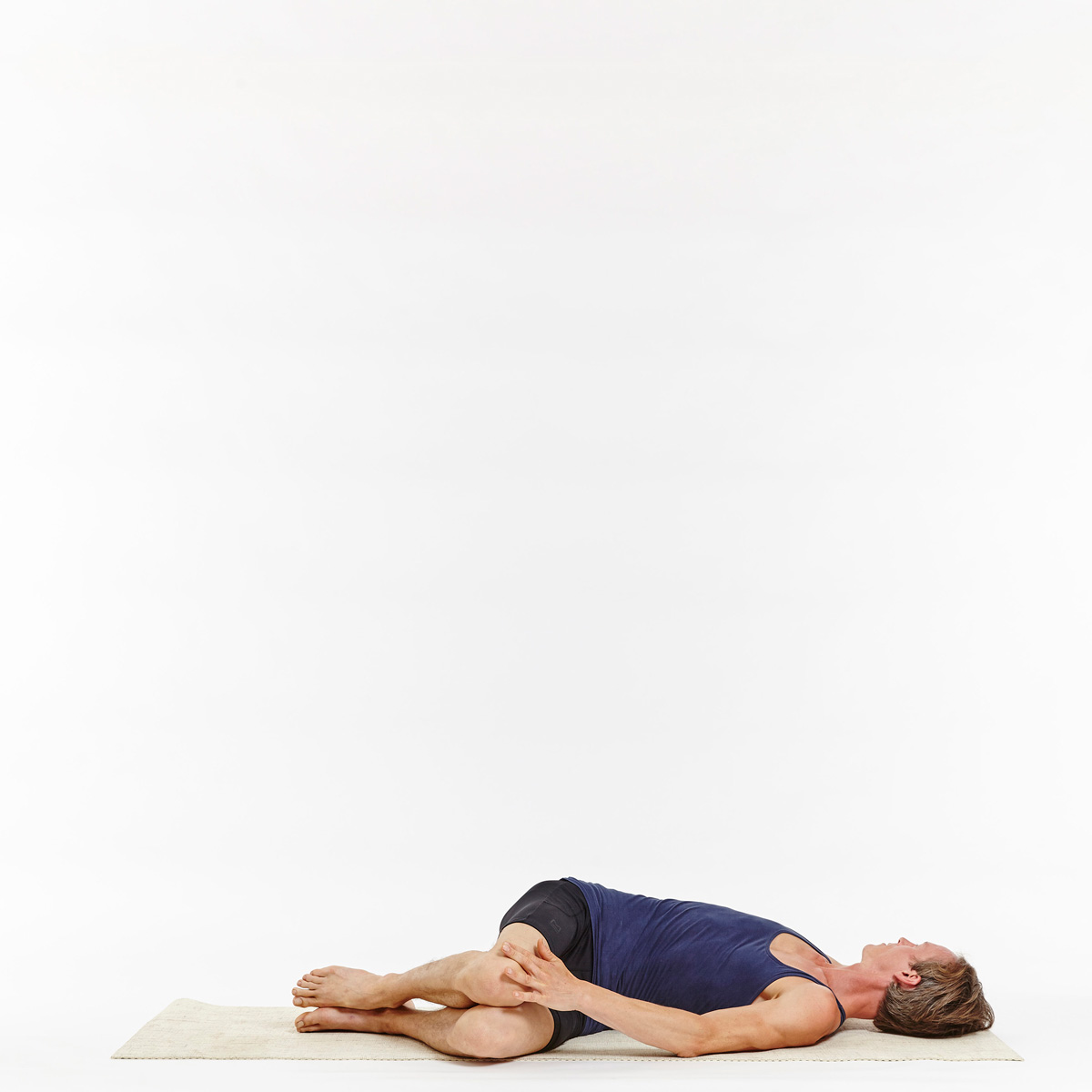 Senior caucasian woman in half spinal twist pose on mat Stock Photo | Adobe  Stock