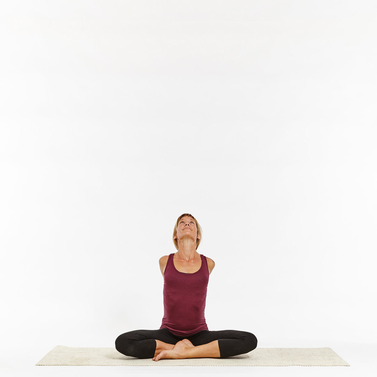 Premium Photo | Female yoga coach seated crosslegged in lotus pose or  padmasana make namaste gesture hands up