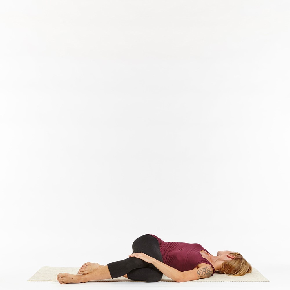 Supine cross-leg spinal twist