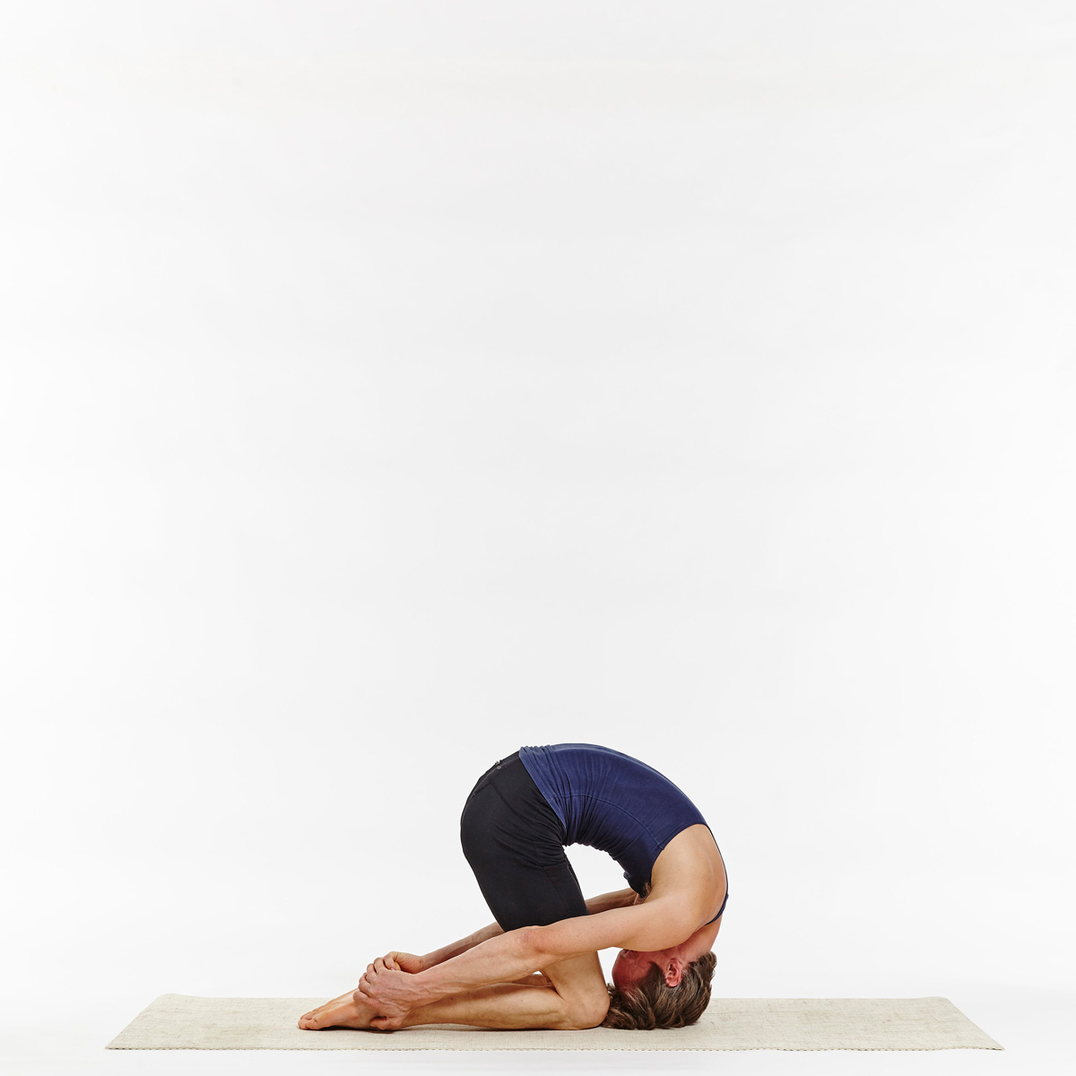 Young woman doing yoga asana Shashankasana – The Hare Pose Stock Photo -  Alamy